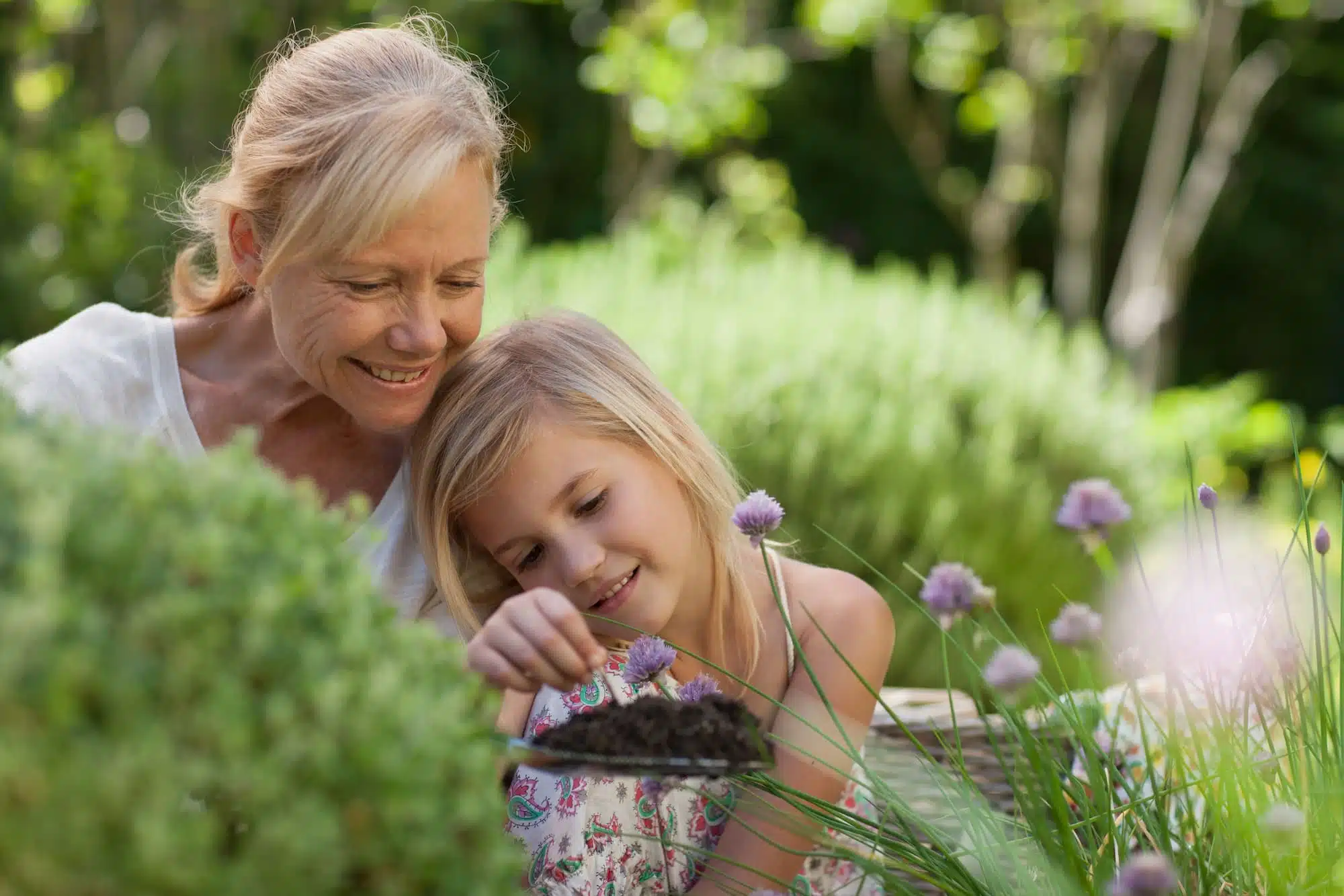 Grandmother and Granddaughter Sitting in a garden