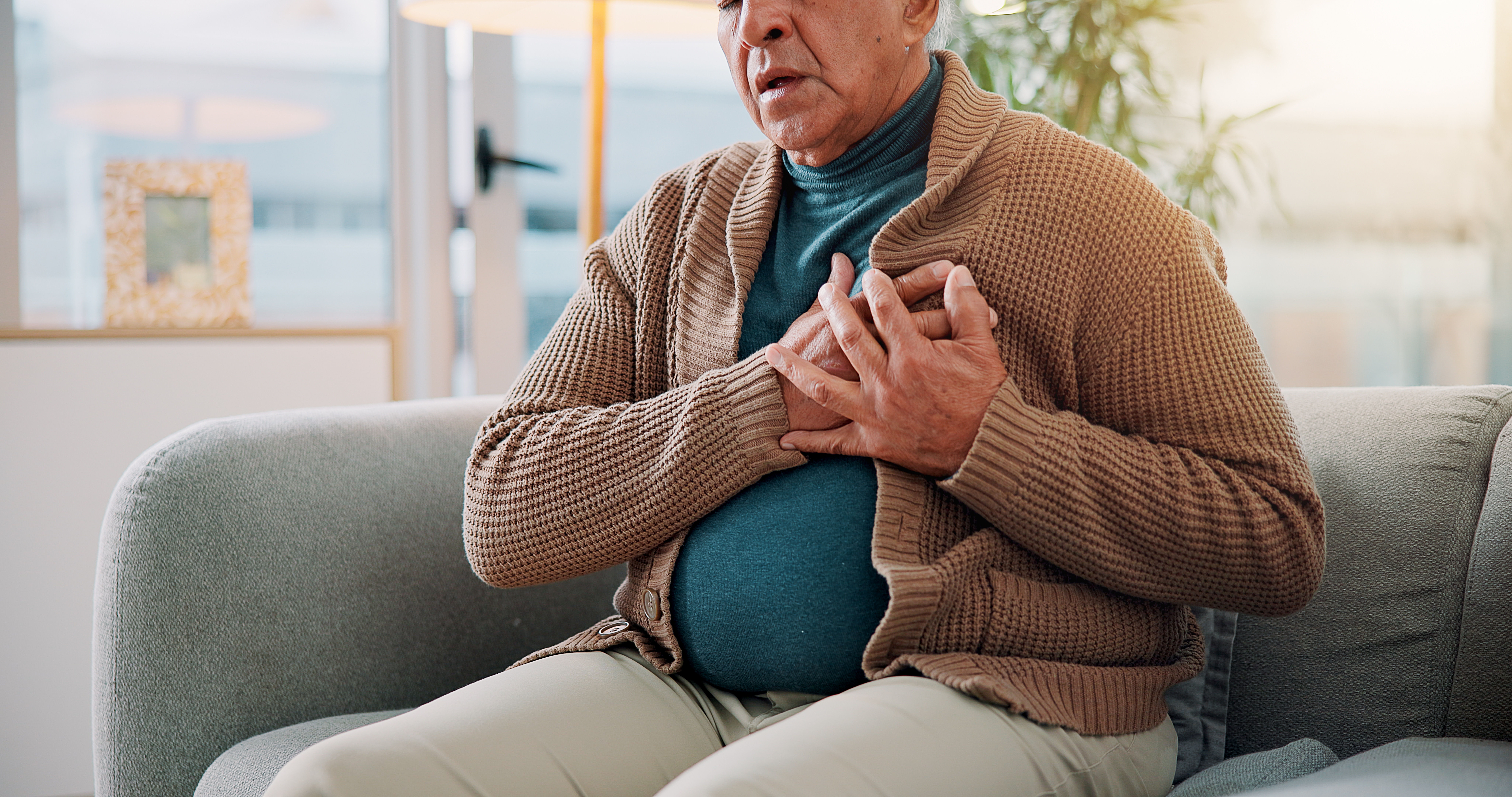 old person touching his chest