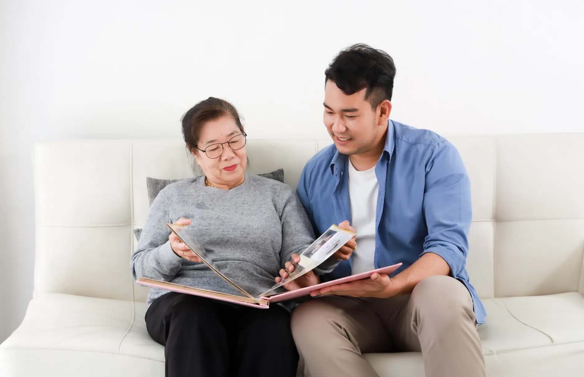 A mother and son doing a scrapbook project together