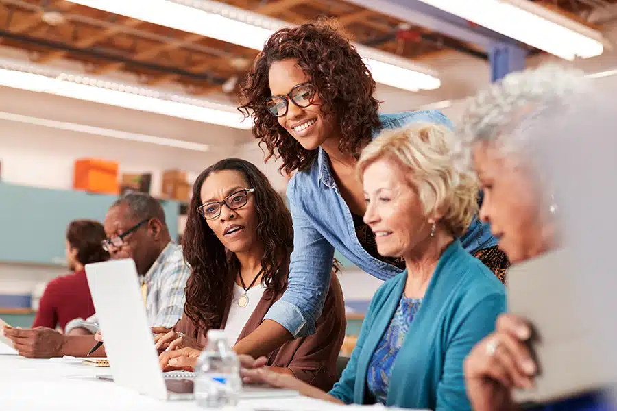 Seniors taking computer lessons at community center