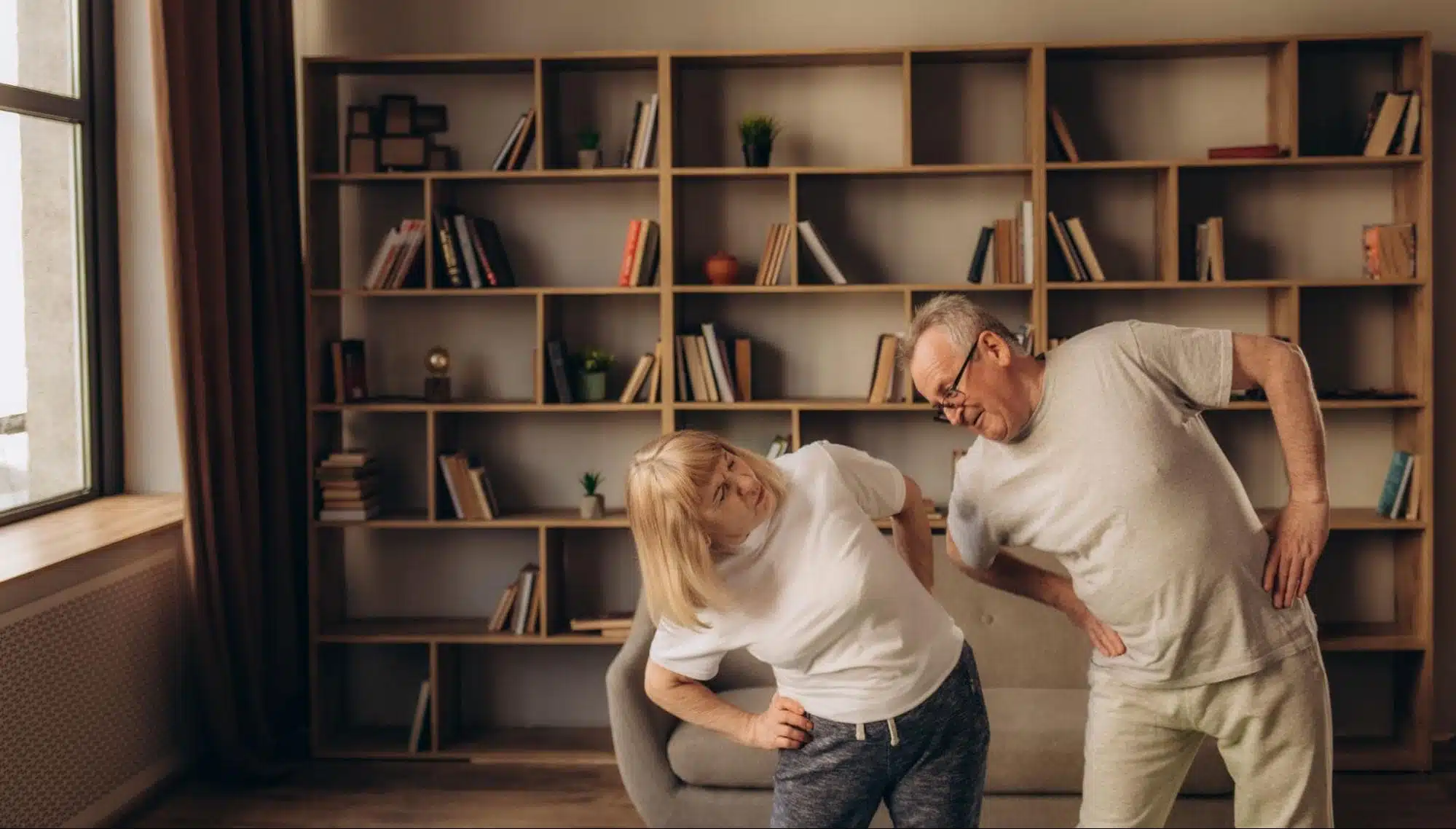 Two seniors doing stretches and exercising