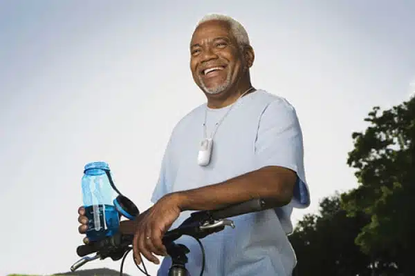Man drinking water while riding a bike