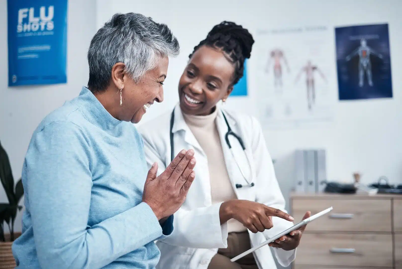 Older person talking to their doctor about medical alert devices.