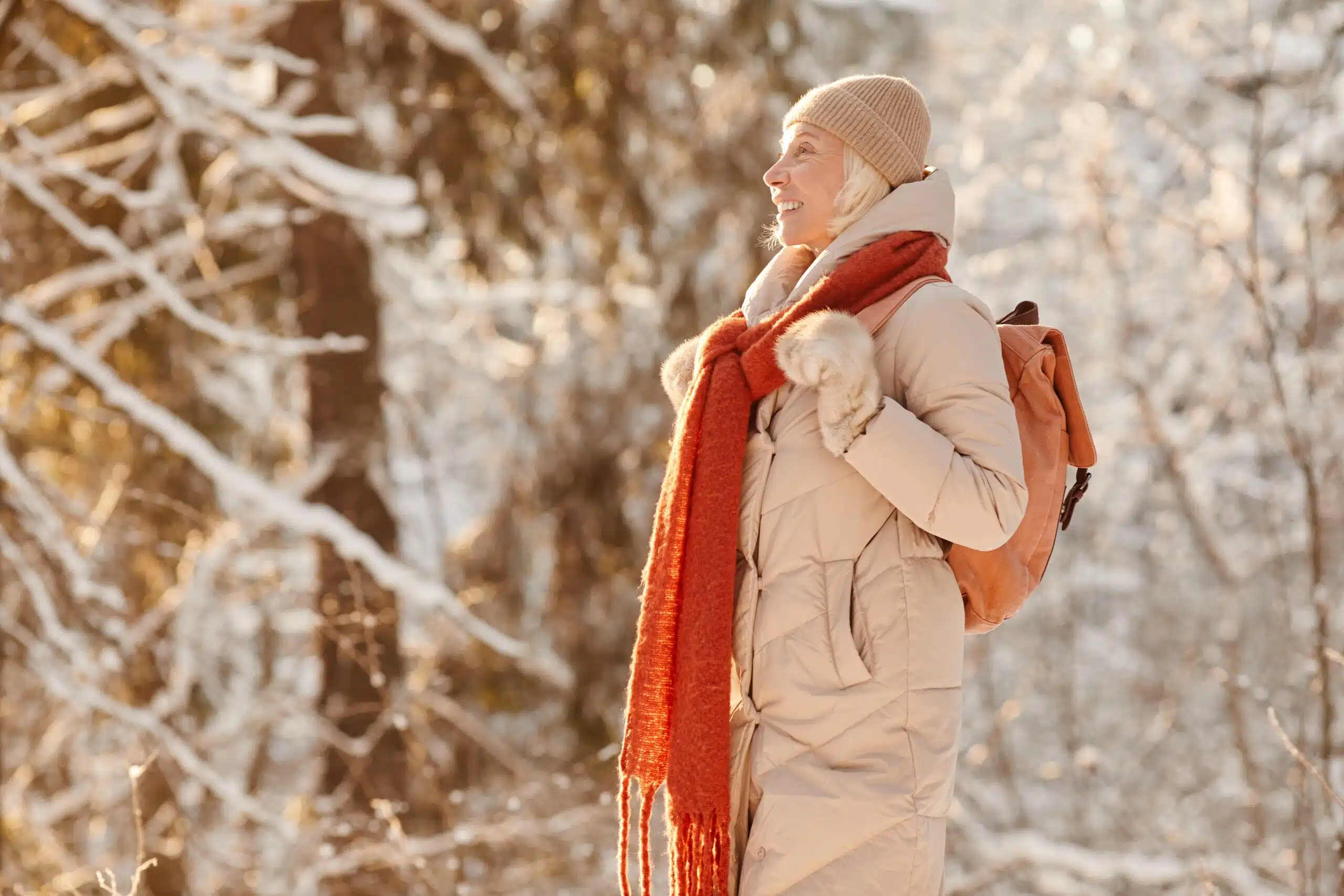 Older woman outside in the proper winter gear for seniors