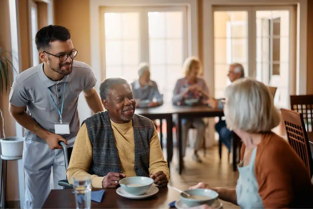 Staff helping senior citizen