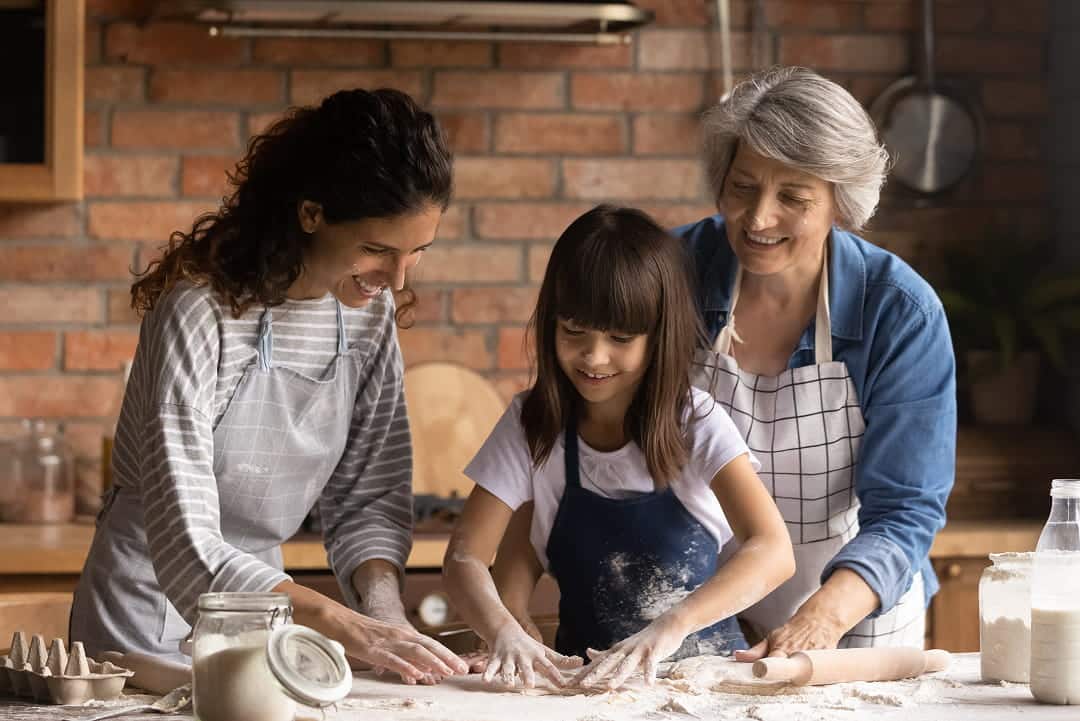 Grandma baking with her daughter and granddaughter